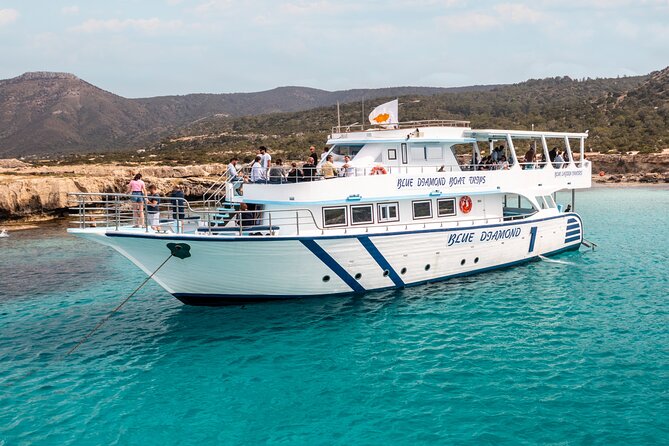 Blue Lagoon cruise: giant slide, music & Paphos hotel transfers - Manolis Bay and Fontana Amorosa: beach time with a story