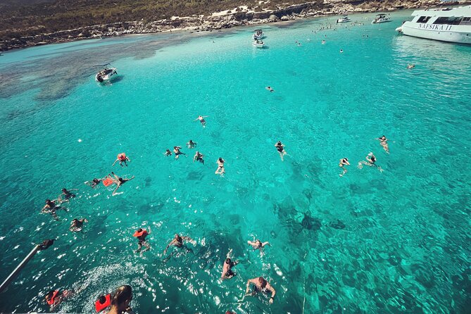 Blue Lagoon trip with slide & music departing from Latchi harbour - Manolis Bay: turquoise water, white sand, and a fisherfolk tale