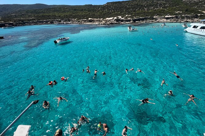 Blue Lagoon trip with slide & music departing from Latchi harbour - The Blue Lagoon swim hour: clear water, golden sand, and snorkeling time