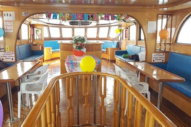 Demetris Chara Boat/Blue Lagoon boat trips with BBQ and SLIDE - Onboard Bar: Drinks, Pricing, and How to Plan