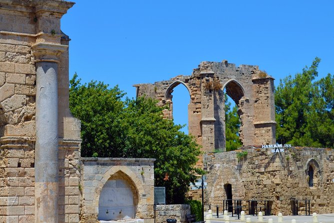 Ghost-Town Famagusta Mini Bus Tour from Protaras and Ayia Napa - Start in Derynia: film, rooftop views, and binoculars over the border