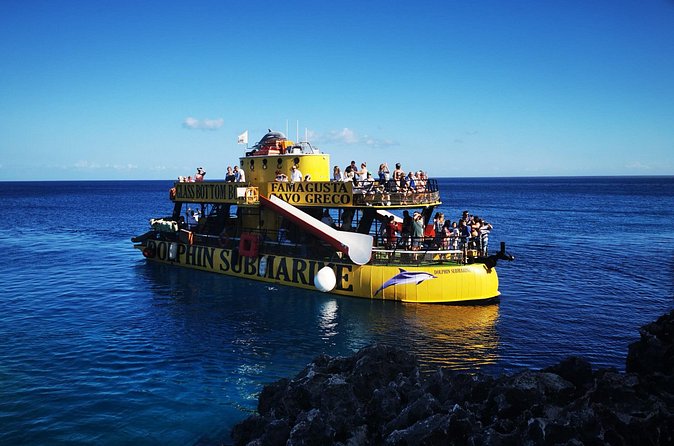 Glass Bottom Boat Dolphin Cruise to Blue Lagoon and Turtle Cove - Green Bay Beach: calm cove water and easy snorkeling time
