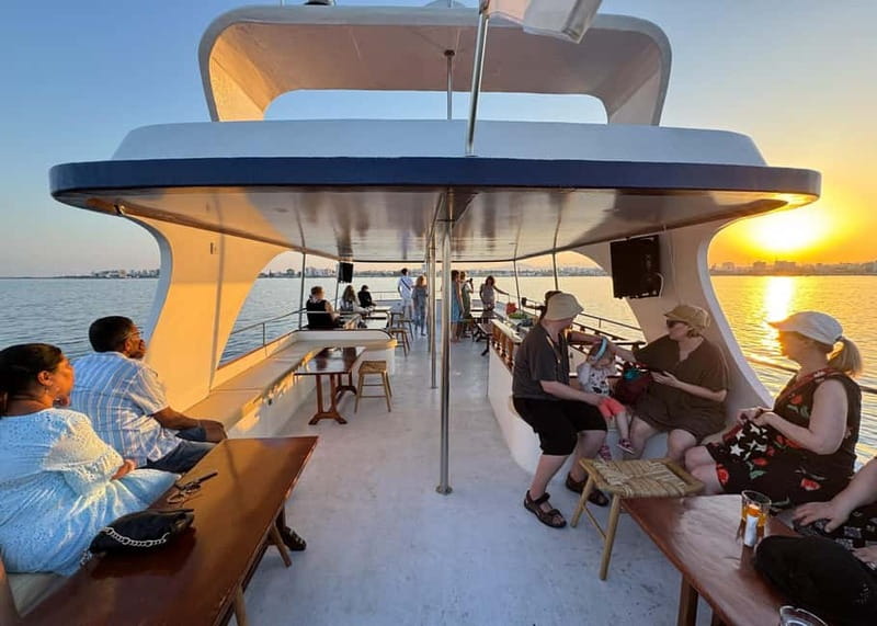 Larnaca: Sunset Cruise with a Glass of Wine - Mackenzie Beach swim stop and the close-up plane show near the runway