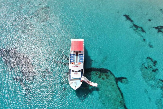 Latchi to Blue Lagoon Glass Bottom+slide Boat Tour - Onboard hospitality: drinks, fruit, and the onboard bar