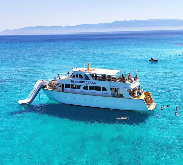 A cruise catamaran anchored in the Blue Lagoon off the Akamas peninsula