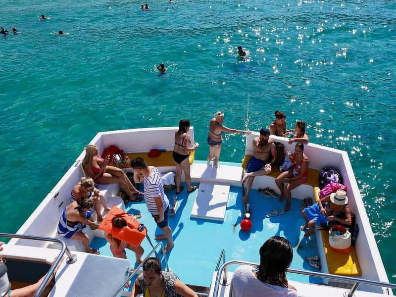 Limassol: Aphrodite Baths & Blue Lagoon Bus & Boat Day Trip - On-board perks: wine, fruit, glass-bottom viewing, and the waterslide