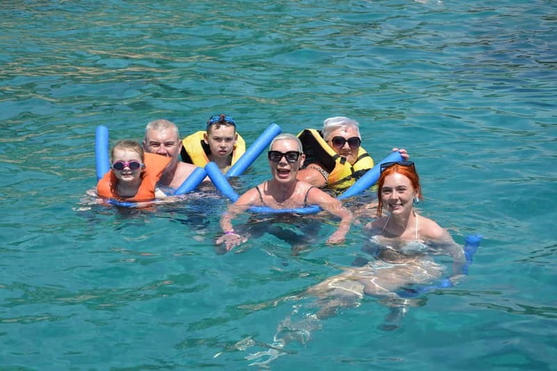 Paphos: Wave Dancer Sunset Cruise with BBQ and Swimming - Swim stop and kayaks: fun water time, with one real caution