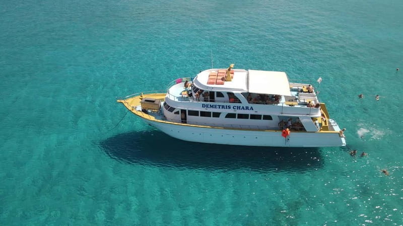 Polis: Blue Lagoon Boat Tour with Optional Barbecue Lunch - From your hotel to Latsi: how the coach ride shapes the day