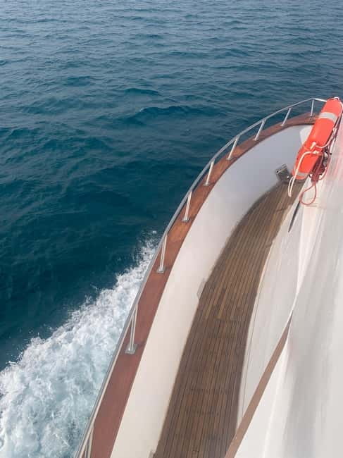 Protaras: 80s and 90s Sunset Cruise with Cypriot Dinner & DJ - Turtle Bay and the No-Guarantee Swim With Turtles